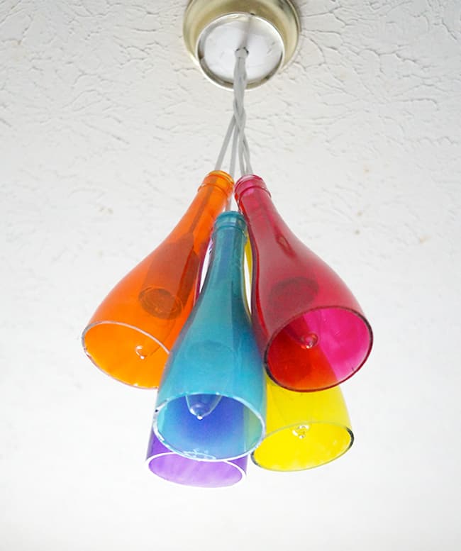 Make a DIY chandelier using wine bottles and Mod Podge Sheer Colors