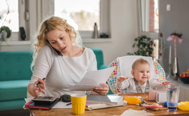 The Life Admin Hour: The Weekly Habit That Keeps Family Chaos Under Control 2 mom baby woman stress laptop Depositphotos 170264784 XL