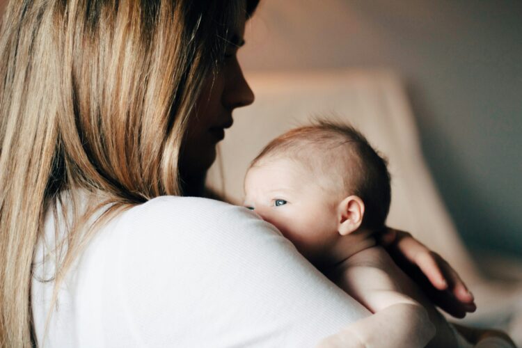Newborn Basics on a Budget: What You Actually Need the First Few Weeks 1 baby newborn mother unsplash