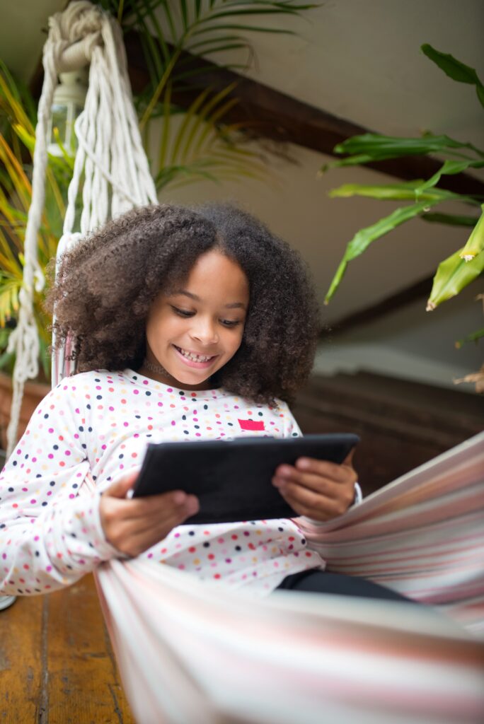 smiling girl using tablet smiling girl using tablet