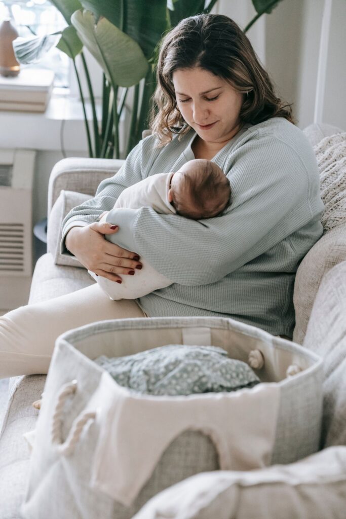 mother holding her newborn baby mother holding her newborn baby