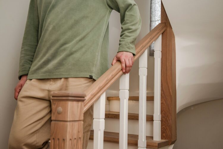 man walking down the stairs man walking down the stairs