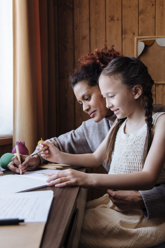 mother helping daughter with homework mother helping daughter with homework